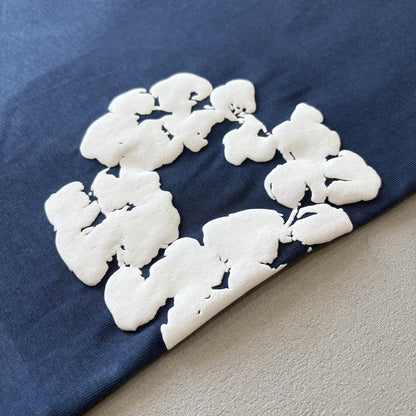 Maglietta con lacrime di denim 