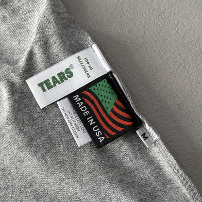 Maglietta con lacrime di denim 