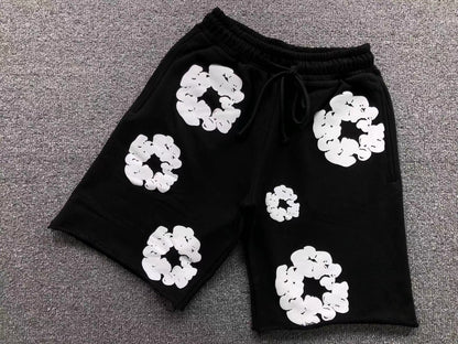 Pantaloncini con strappi in denim