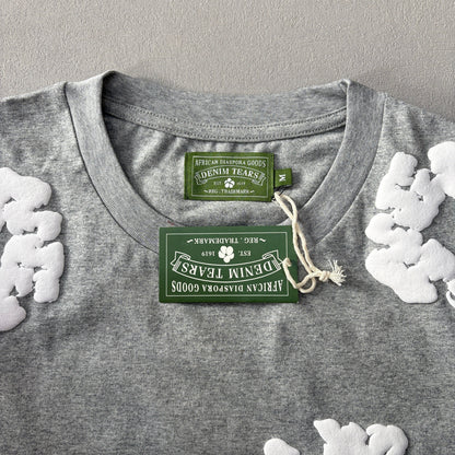 Maglietta con lacrime di denim 