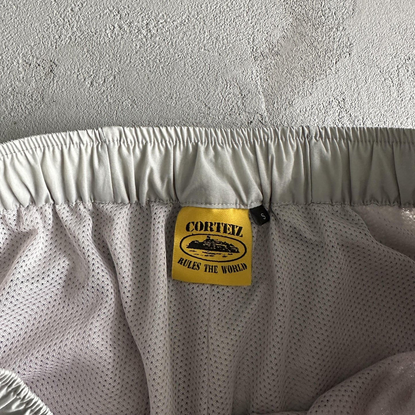 Pantaloncini da corsa e pioggia Corteiz