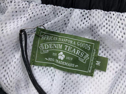 Tuta da bagno con strappi in denim