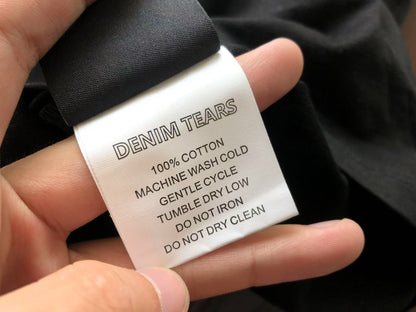 Maglietta con lacrime di denim 