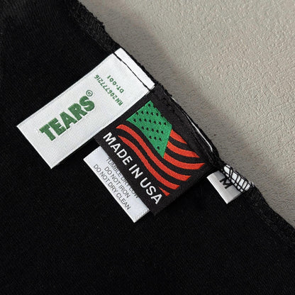 Maglietta con lacrime di denim 