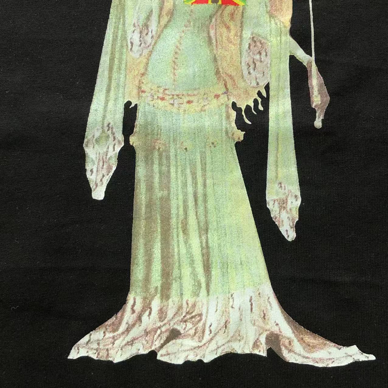 Maglietta con lacrime di denim 